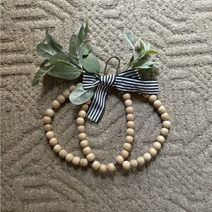 Wooden Bead Pumpkin Decor with Greenery and Striped Bow